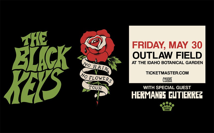 Concert poster for The Black Keys' 'No Rain No Flowers Tour.' The poster features the band's name in bold green stylized text, alongside a red rose with a banner reading 'No Rain No Flowers Tour.' The event details in bold text state: 'Friday, May 30, Outlaw Field at the Idaho Botanical Garden.' Ticket sales are available at Ticketmaster.com. Logos for CMoore Concerts and Easy Eye Sound appear at the bottom.