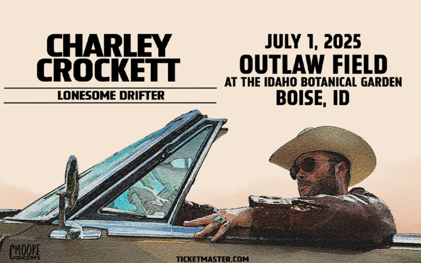 Concert poster for Charley Crockett's 'Lonesome Drifter' tour. The event is scheduled for July 1, 2025, at Outlaw Field at the Idaho Botanical Garden in Boise, ID. The poster features an illustration-style image of Charley Crockett wearing a cowboy hat and sunglasses, driving a classic convertible with the top down. The background is a beige gradient, and the text is bold and black. Ticket information directs to Ticketmaster, and the CMoore Concerts logo is displayed at the bottom.